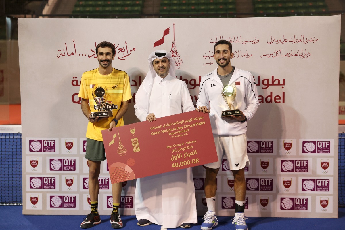 QTSBF Secretary-General Tareq Zainal poses for a picture with Jabour Al Mutawa and Mohammed Al Khenji, who won Category (A) titles.  