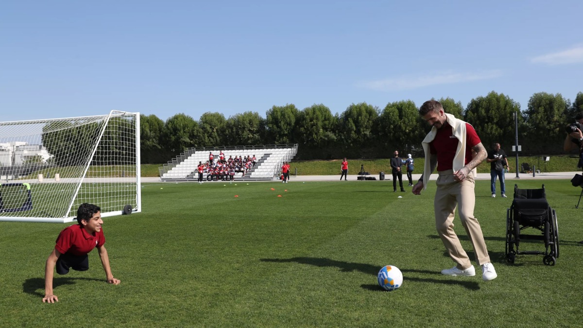 English football legend David Beckham plays with Qatar Paralympian Ghanim Al Muftah. 