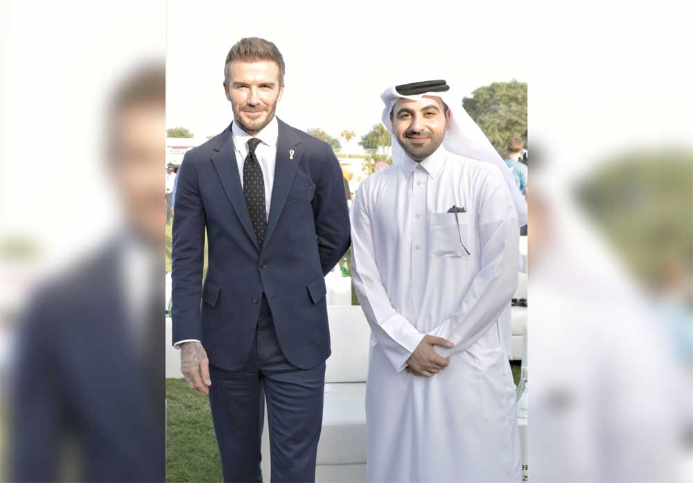 Ahmad Mohamed Zebeib (right), Deputy CEO of QLM, with David Beckham, in Doha, recently. 