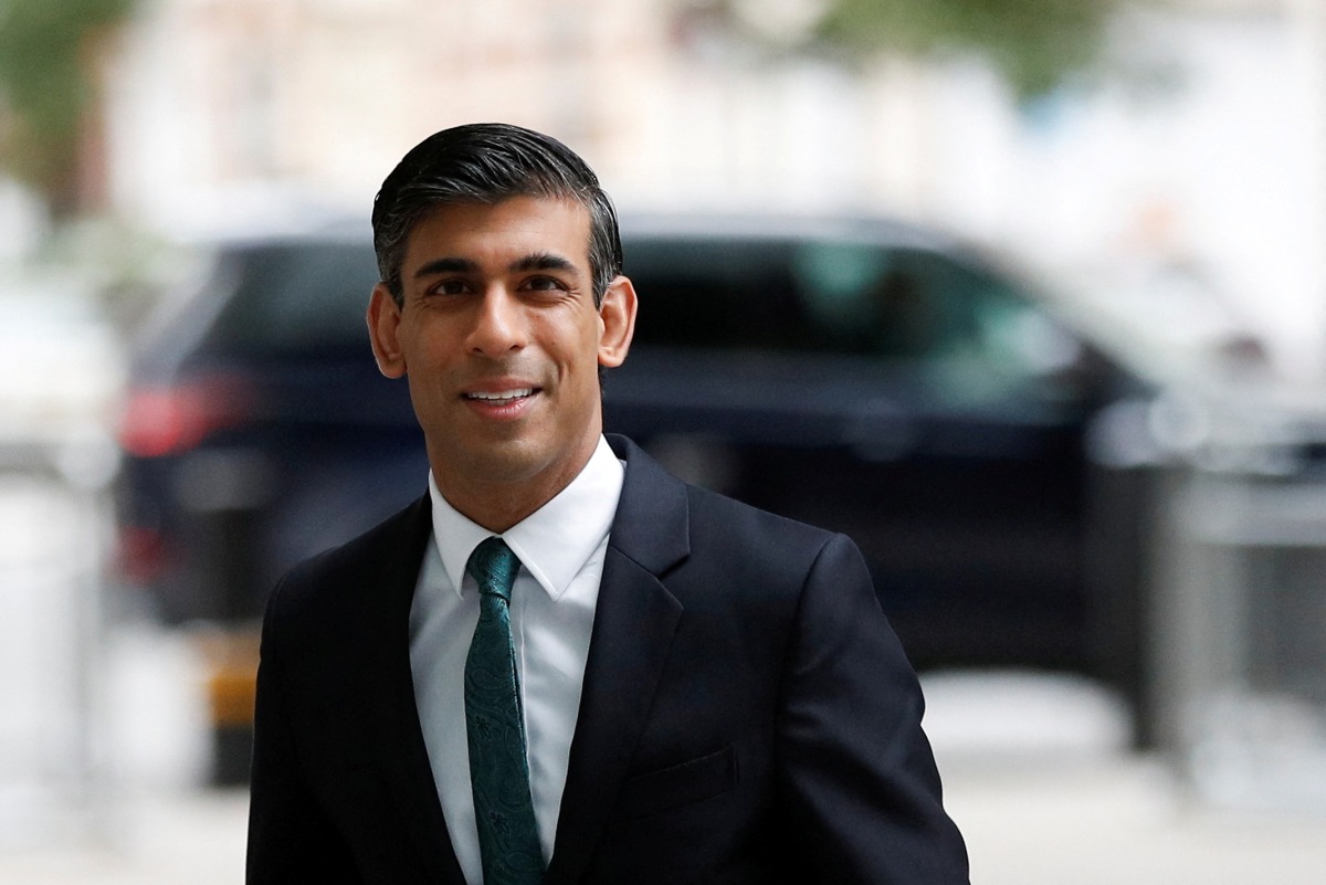 FILE PHOTO: Britain's Chancellor of the Exchequer Rishi Sunak arrives at Broadcasting House to take part in an interview on BBC's 'The Andrew Marr Show', in London, Britain, October 24, 2021. REUTERS/Peter Nicholls/File Photo

