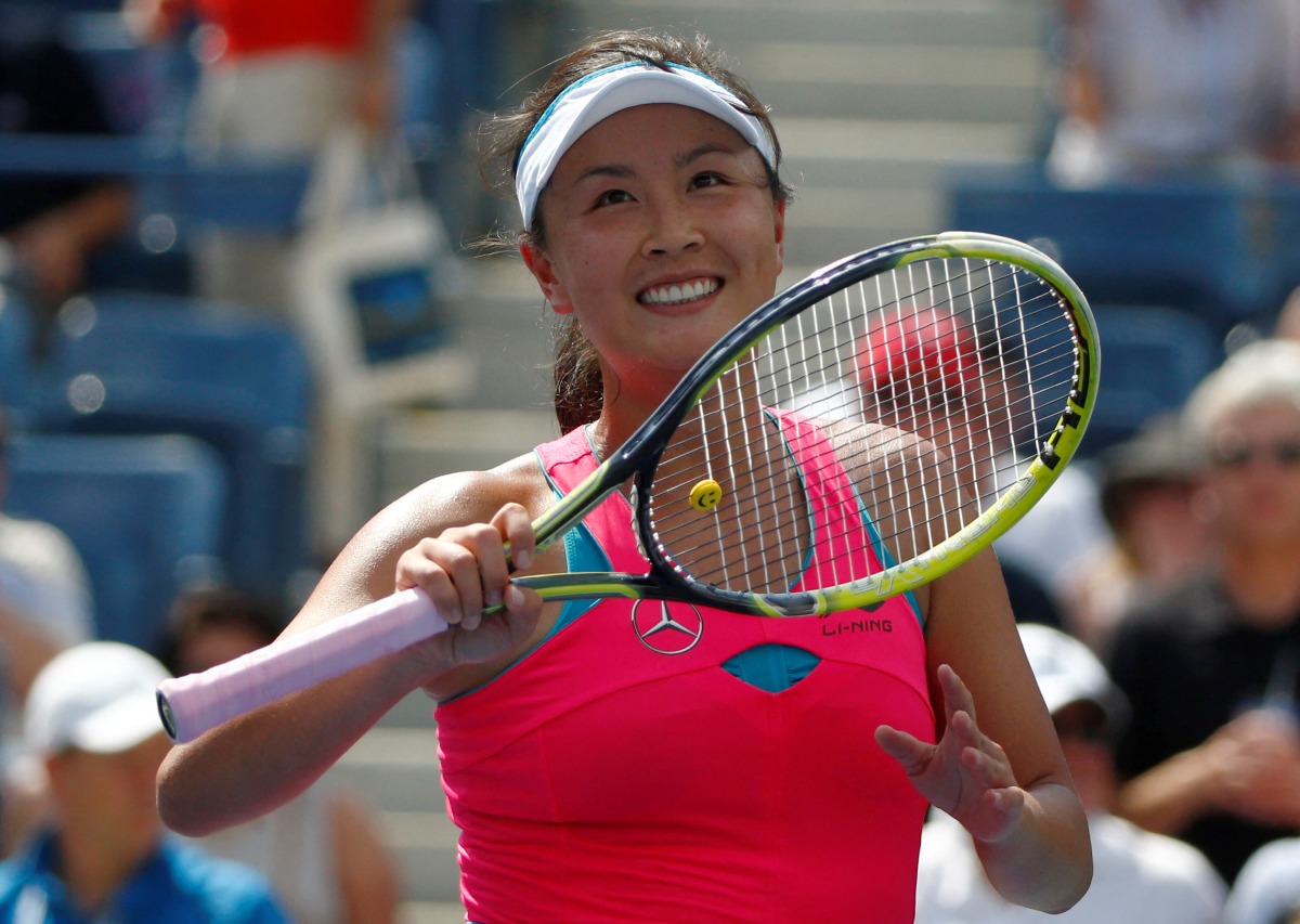FILE PHOTO: Peng Shuai of China reacts after her victory over Belinda Bencic of Switzerland in their quarterfinals match at the 2014 U.S. Open tennis tournament in New York, U.S. September 2, 2014. REUTERS/Adam Hunger/File Photo
