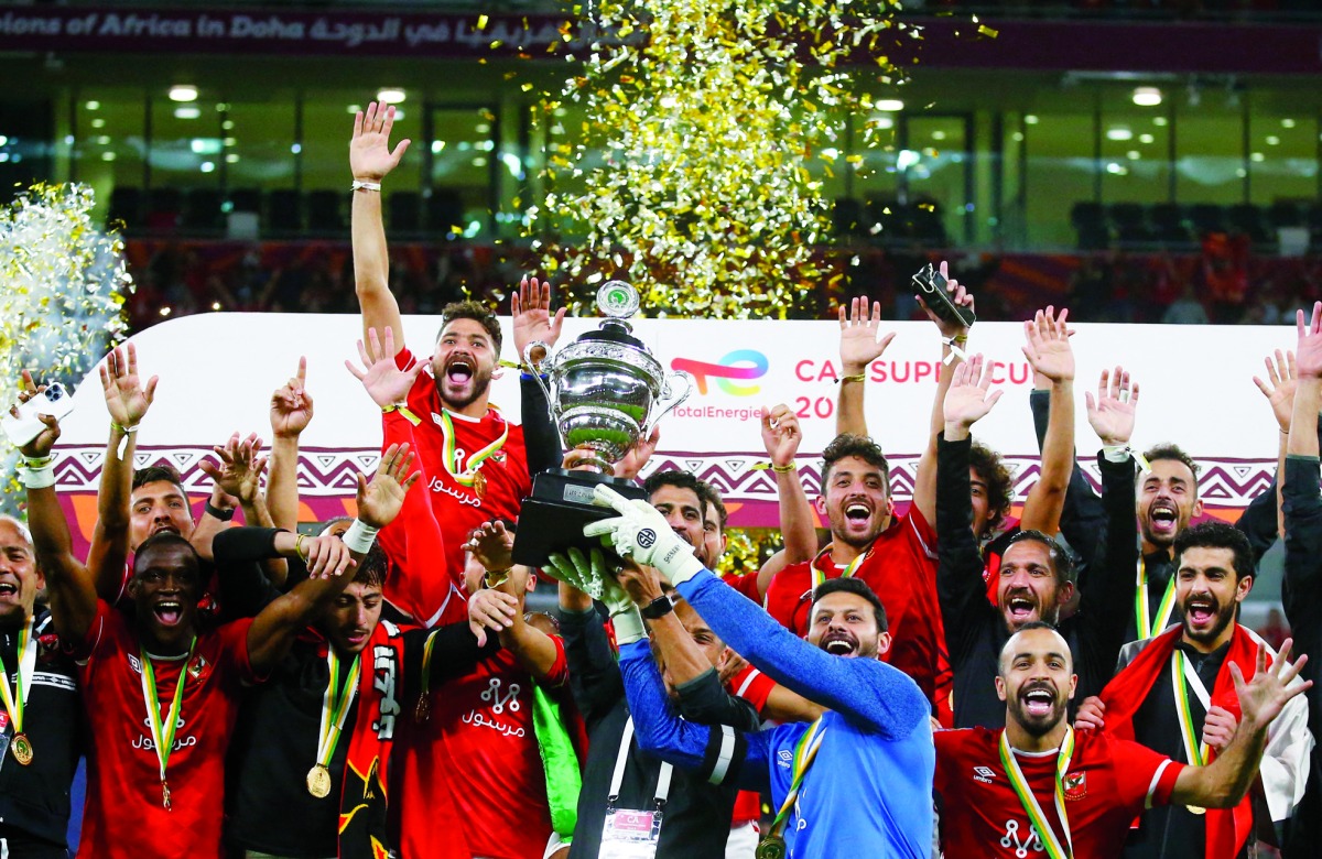 Al Ahly players celebrate after winning the penalty shootout to clinch their eighth TotalEnergies CAF Super Cup title at the Ahmed bin Ali Stadium in Umm Al Afaei, yesterday. 