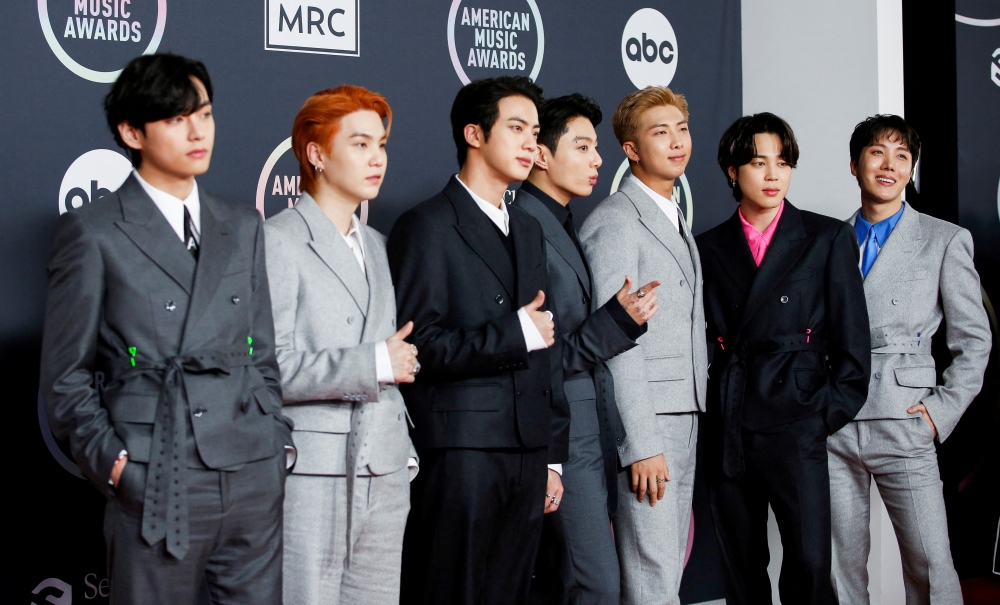 V, Suga, Jin, Jungkook, RM, Jimin and J-Hope of BTS arrive at the 2021 American Music Awards at the Microsoft Theater in Los Angeles, California, U.S., November 21, 2021. REUTERS/Aude Guerrucci/File Photo