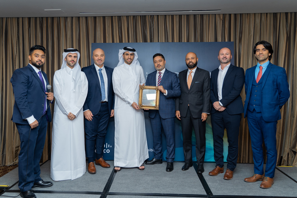 Thani Ali Al Malki, Executive Director Business, Ooredoo Qatar, receiving the award from Cisco at en event in Doha.  