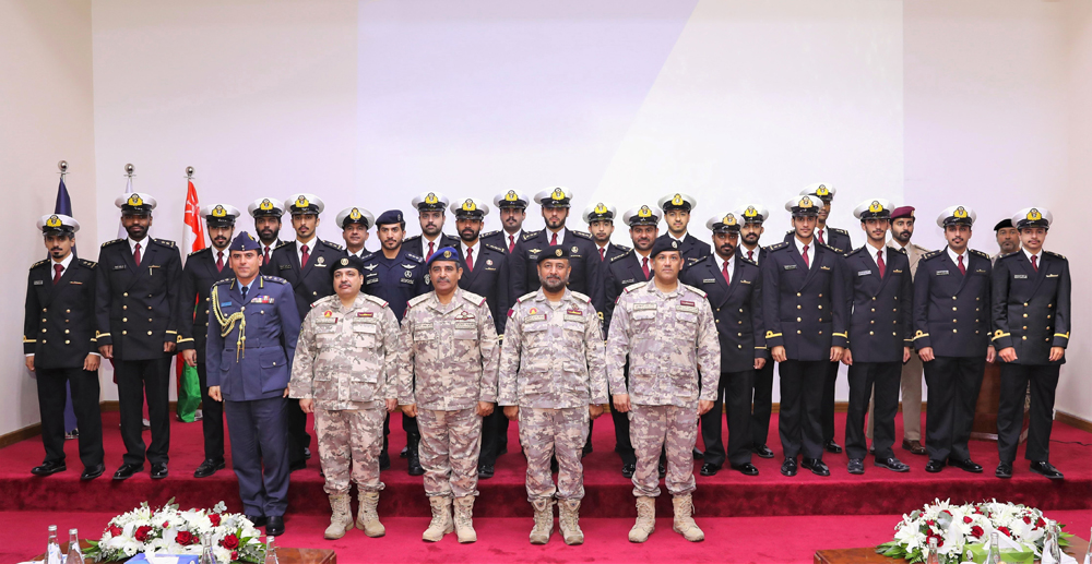 Chief of Staff of the Armed Forces H E Staff Lieutenant General (Pilot) Salem bin Hamad bin Mohammed bin Aqeel Al Nabit and other officers with participants of training courses arranged by the Amiri Naval Forces. 