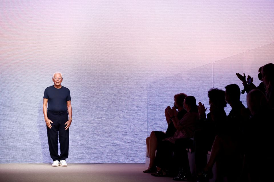 Designer Giorgio Armani appears at the end of the Giorgio Armani Spring/Summer 2022 collection during Milan Fashion Week in Milan, Italy, September 25, 2021. REUTERS/Alessandro Garofalo

