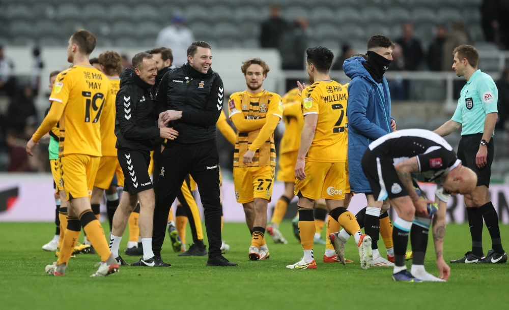 Cambridge United coach Mark Bonner celebrates with players after the match Action Images via Reuters/Lee Smith
