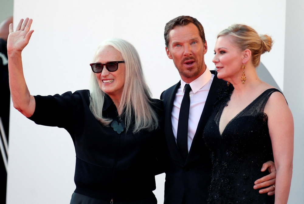 'The Power of the Dog' director Jane Campion, actor Benedict Cumberbatch and actor Kirsten Dunst pose. Reuters/Yara Nardi/File Photo