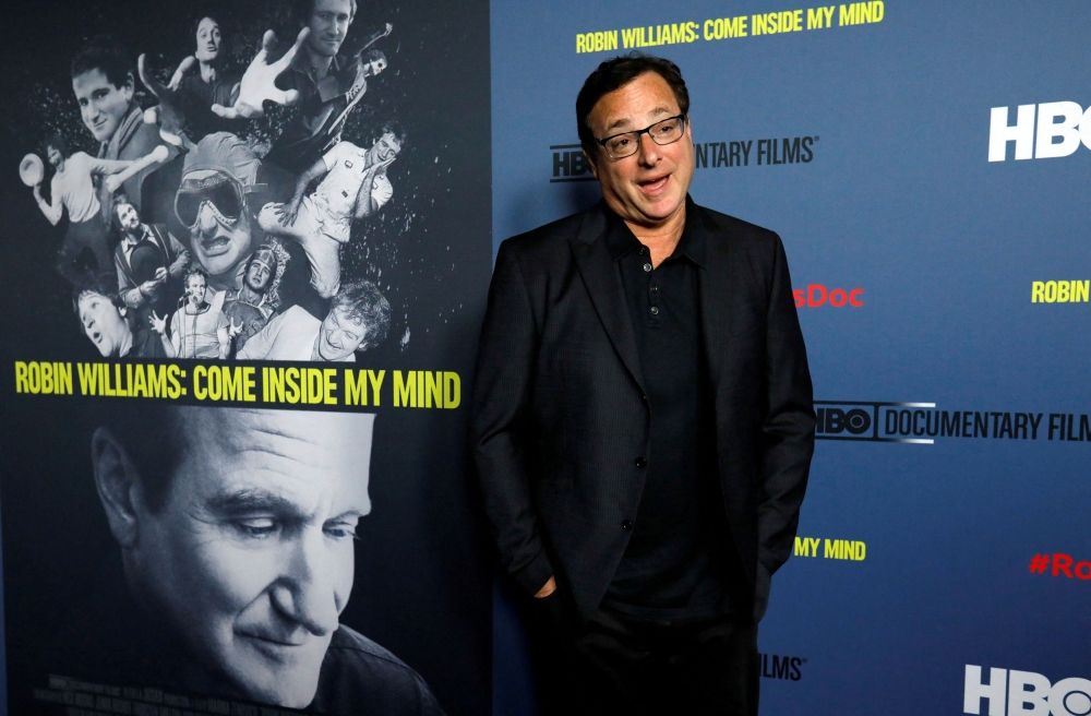 Comedian Bob Saget poses at the premiere for the documentary 