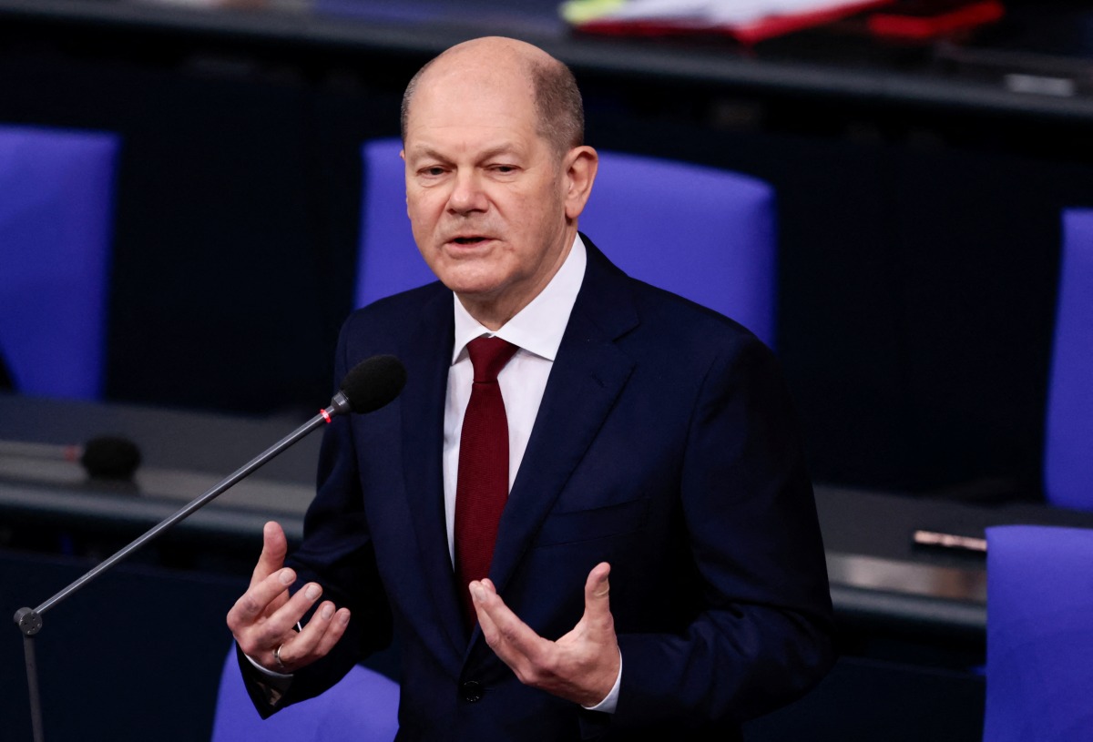 German Chancellor Olaf Scholz speaks during his first questioning session with lawmakers at the lower house of parliament Bundestag in Berlin, Germany, January 12, 2022. REUTERS/Hannibal Hanschke
