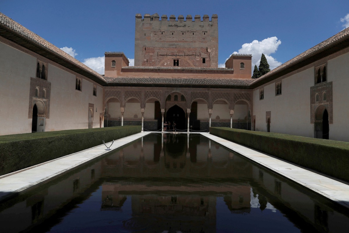 FILE PHOTO: Tourists visit the Alhambra Palace in Granada, Spain June 17, 2020. REUTERS/Jon Nazca/File Photo
