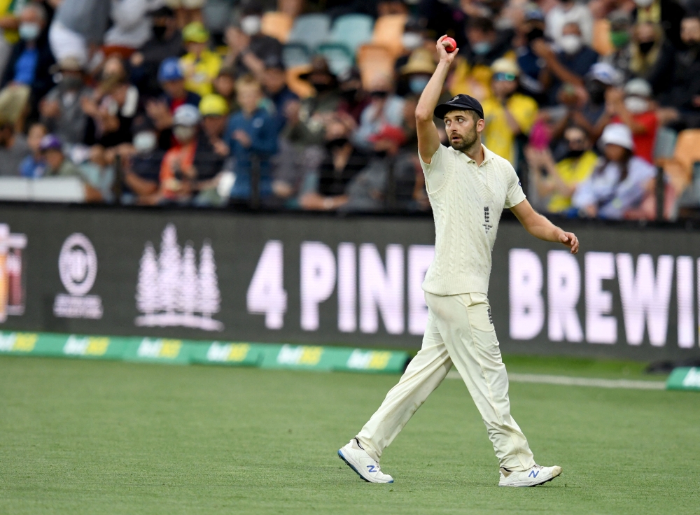 England's Mark Wood leaves the field after taking 6 wickets Darren England/AAP Image via Reuters