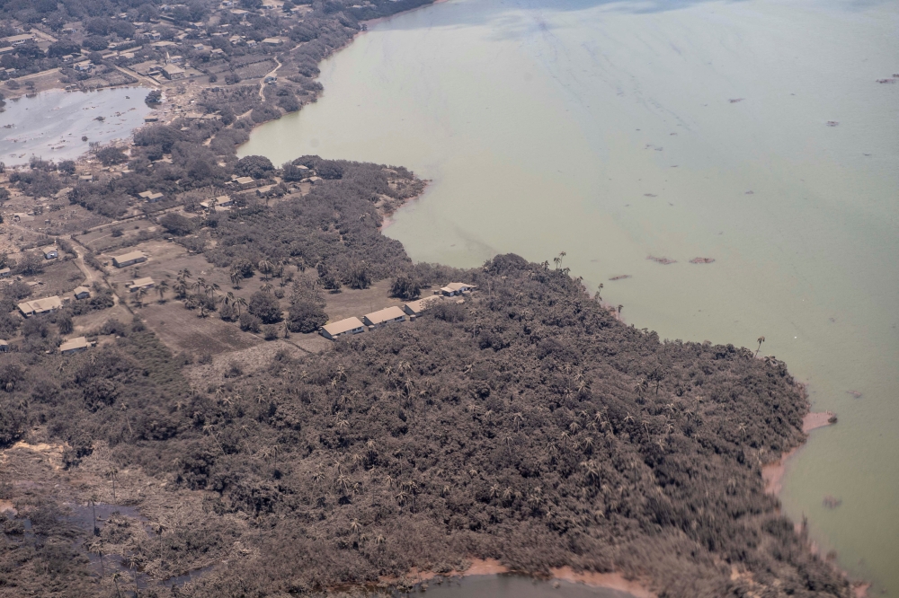 A general view from a New Zealand Defence Force P-3K2 Orion surveillance flight shows ash covered homes and vegetation over an area in Tonga. Picture taken January 17, 2022. New Zealand Defence Force/Handout via Reuters