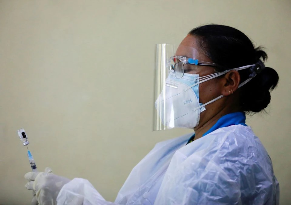 A healthcare worker draws a dose of the Johnson & Johnson vaccine against the coronavirus disease (COVID-19) into a syringe at Nepal Disabled Association Khagendra New Life Centre in Kathmandu, Nepal, July 19, 2021. REUTERS/Navesh Chitrakar



