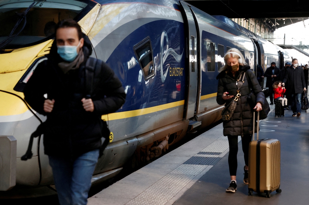 Passengers arrive at the Eurostar terminal at Gare du Nord train station, after France eased travel restrictions for travellers from Britain amid the spread of the coronavirus disease (COVID-19) pandemic, in Paris, France, January 14, 2022. REUTERS/Noemie Olive/File Photo