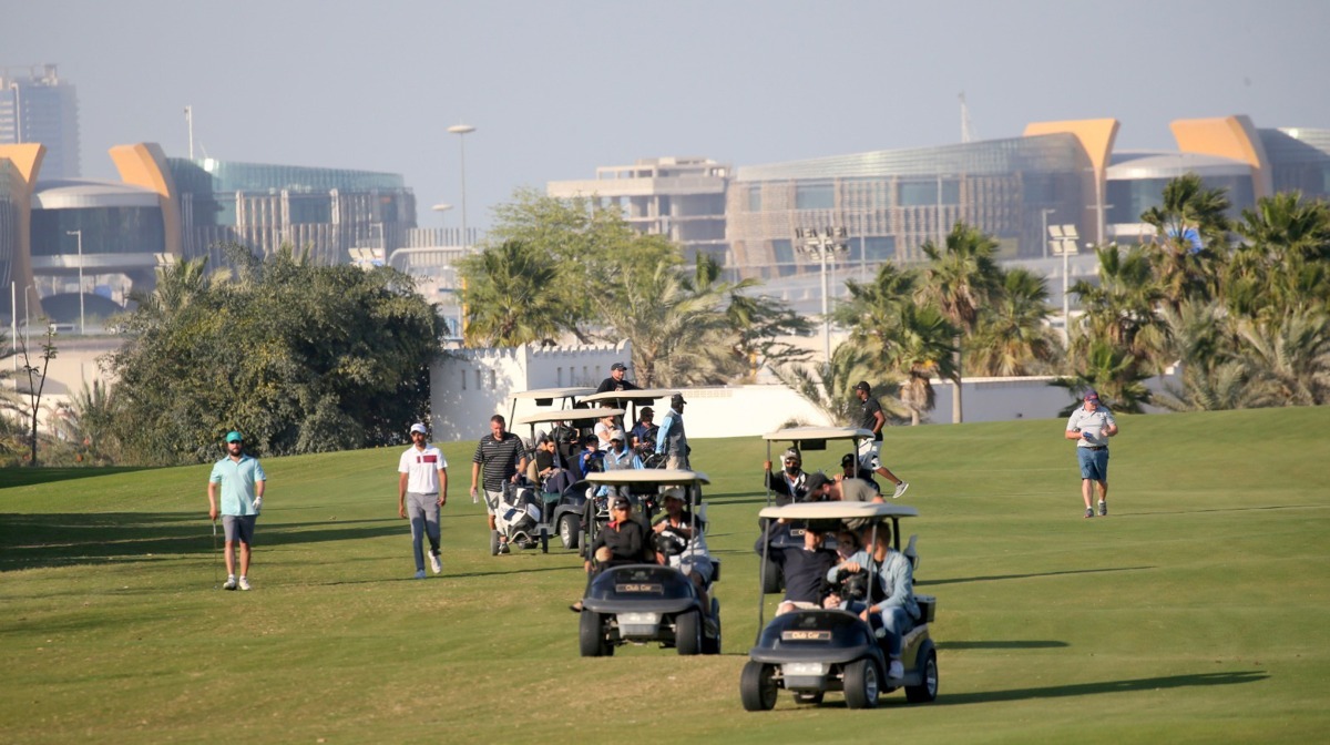 Players in action at Doha Golf Club.