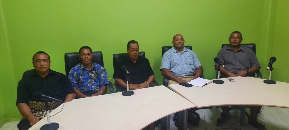 Lisala Folau, a Tongan man who says he swam for around 27 hours after getting swept to sea by Saturday's tsunami, sits with other people of Atata island in Nuku'alofa, Tonga, January 19, 2022 in this picture obtained from social media. Marian Kupu/ Broadcom Broadcasting FM87.5/via REUTERS