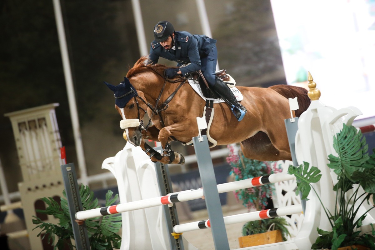 Saeed Nasser Al Qadi guides Electra B over a fence