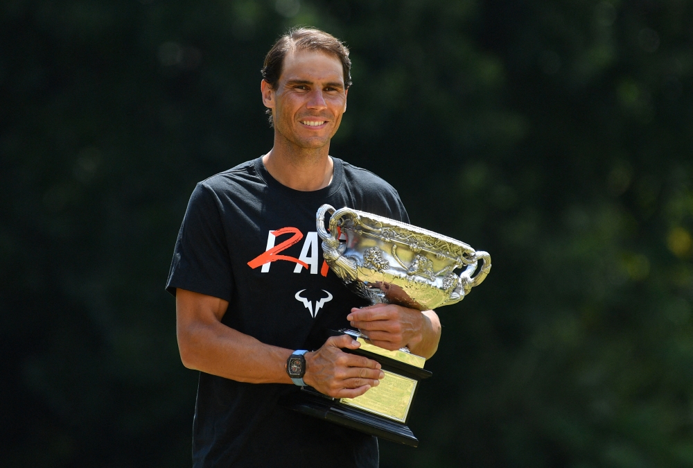January 31, 2022 Spain's Rafael Nadal poses with the Norman Brookes Challenge Cup trophy after winning the Australian Open Joel Carrett/AAP Image via REUTERS