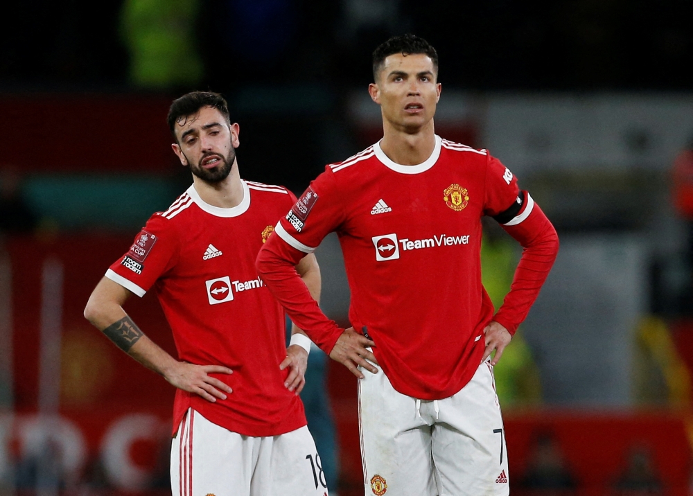 Manchester United's Cristiano Ronaldo and Bruno Fernandes react REUTERS/Craig Brough
