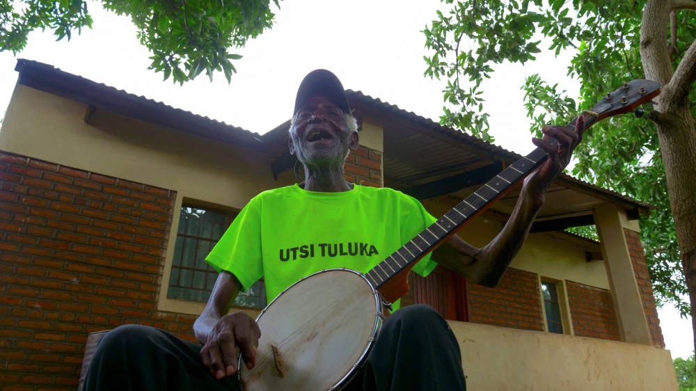 Malawian musician Giddes Chalamanda plays his song Linny Hoo, at his home in Chiradzulu village, January 28, 2022. Reuters/Eldson Chagara