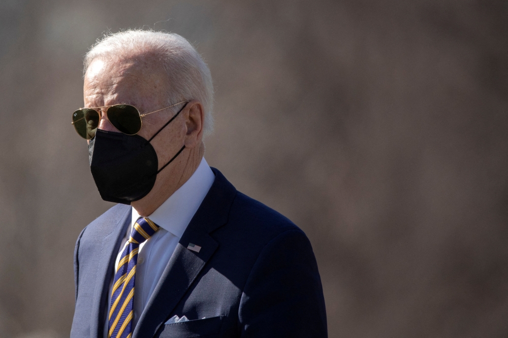 U.S. President Joe Biden walks on the South Lawn of the White House to board Marine One, in Washington, U.S., February 10, 2022. REUTERS/Tom Brenner