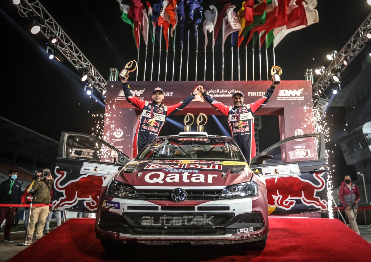 Nasser Saleh Al Attiyah and co-driver Mathieu Baumel celebrate after winning the title.