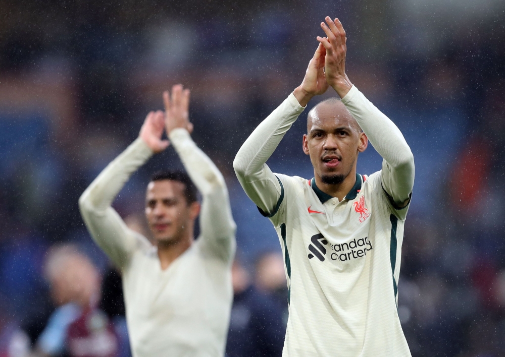 Liverpool's Fabinho and Thiago Alcantara applaud fans after the match REUTERS/Russell Cheyne