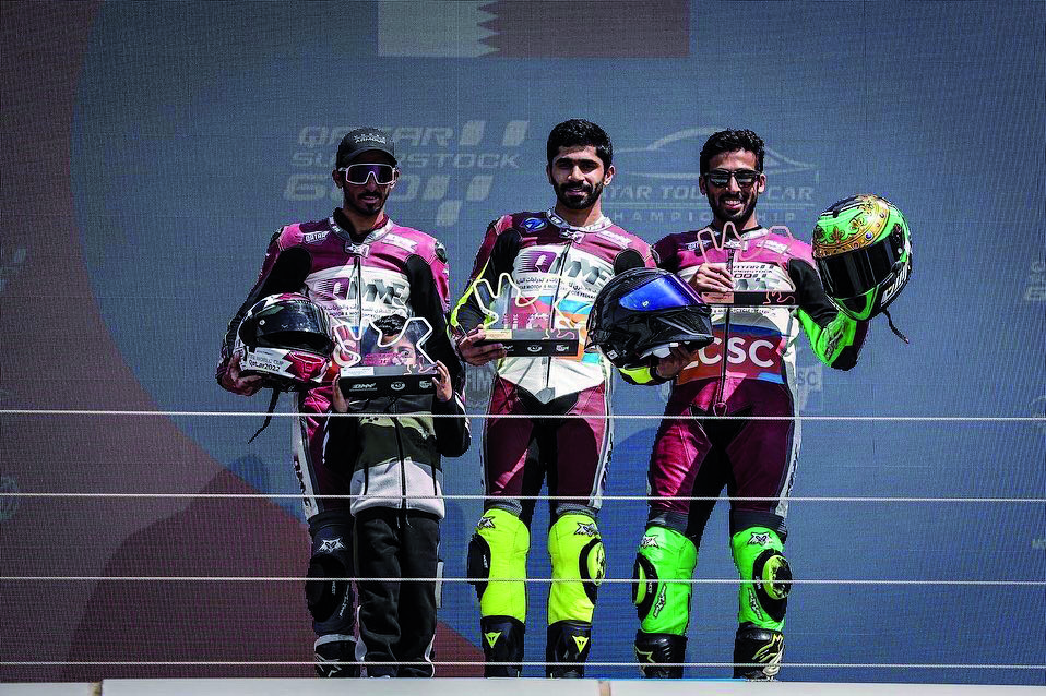 The podium winners of Race 2 of the fourth round of Qatar SuperStock 600 celebrate with their trophies.