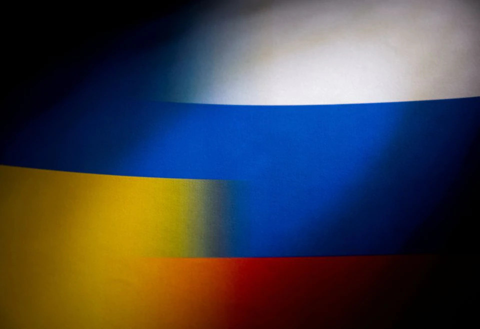 Russia's and Ukraine's flags are seen printed on paper in this illustration taken January 27, 2022. REUTERS/Dado Ruvic/Illustration

