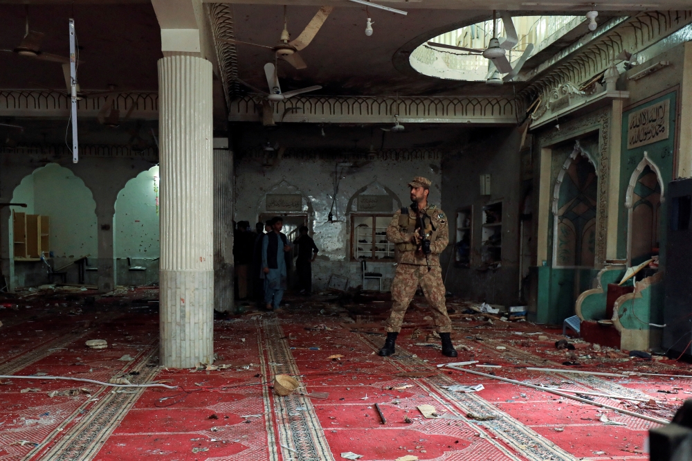 An army soldier stands amid the damages at the prayer hall after a bomb blast inside a mosque during Friday prayers in Peshawar, Pakistan, March 4, 2022. REUTERS/Fayaz Aziz