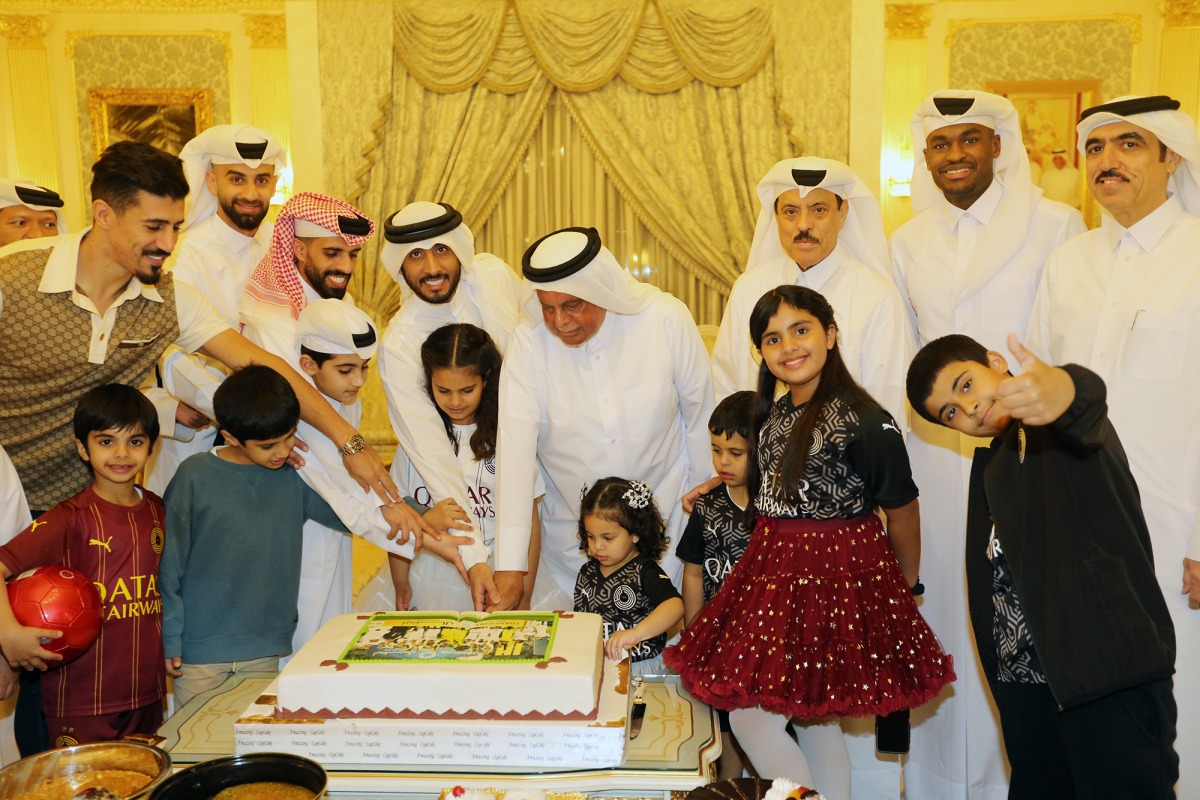 Al Sadd players and team officials celebrate winning the QNB Stars League Falcon Shield for a record 16th time with the club founder H E Abdullah bin Hamad Al Attiyah.