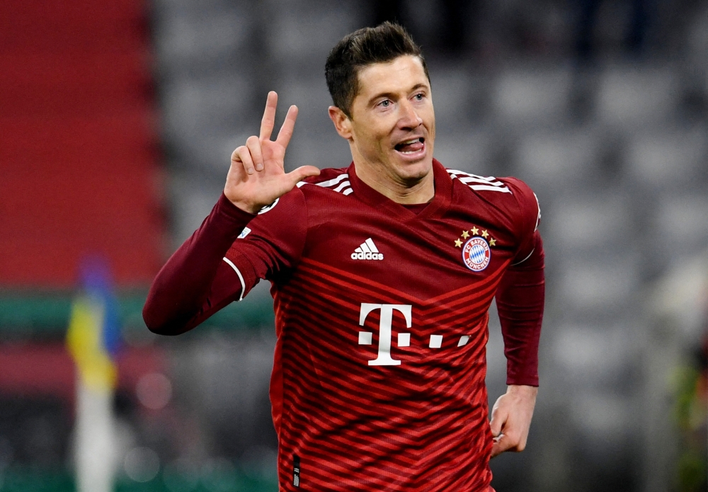 Bayern Munich's Robert Lewandowski celebrates scoring their third goal to complete his hat-trick REUTERS/Andreas Gebert
