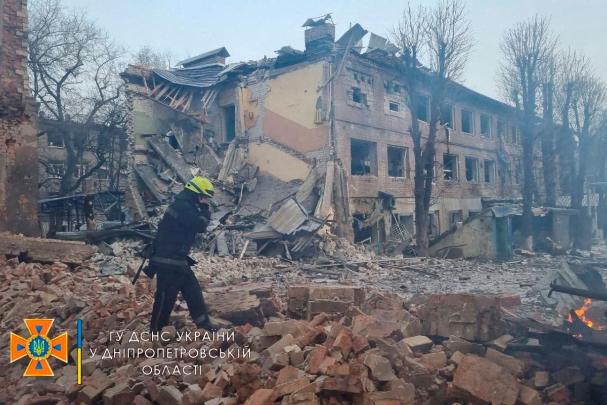 A rescuer works among remains of buildings damaged by an airstrike, as Russia's attack on Ukraine continues, in Dnipro, Ukraine, in this handout picture released March 11, 2022. Press service of the State Emergency Service of Ukraine/Handout via REUTERS