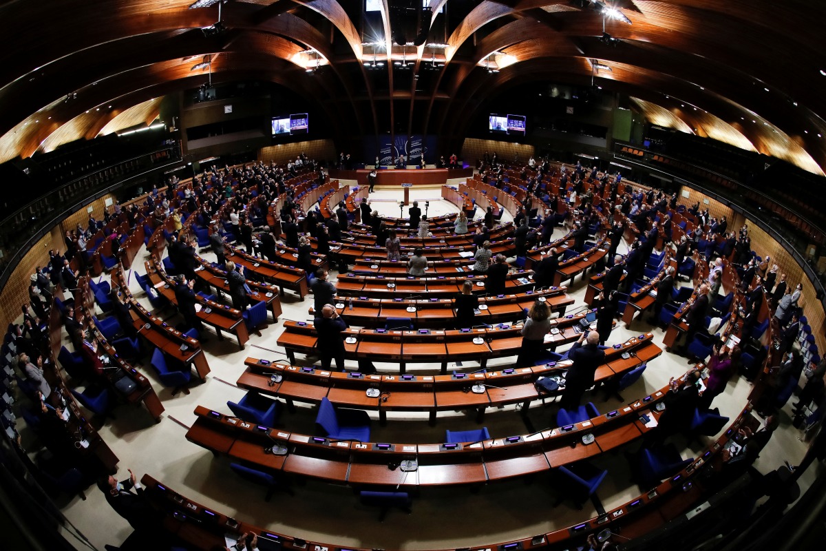 Ukrainian Prime Minister Denys Shmyhal receives standing ovation from Members of the Parliamentary Assembly of the Council of Europe after his address via videolink, in an extraordinary session to discuss Russia's invasion of Ukraine, in Strasbourg, France March 14, 2022. REUTERS/Arnd Wiegmann
