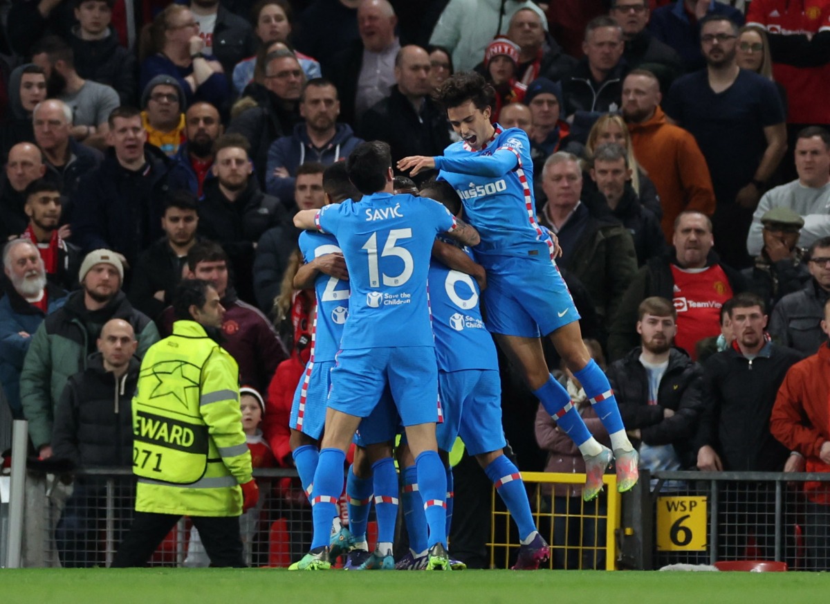 Atletico Madrid’s Renan Lodi celebrates with team-mates after scoring against Manchester United.