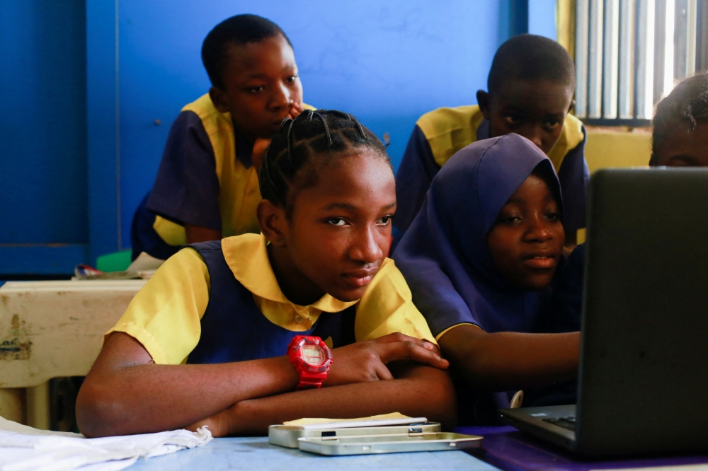 Faridat Bakare, 12, a student enrolled in a special STEM programme for children from poor families at the Knosk Secondary School, for which she pays 100 naira ($0.25) per day, attends a class in Kuje, Abuja, Nigeria February 18, 2022. Picture taken February 18, 2022. REUTERS/Afolabi Sotunde
 