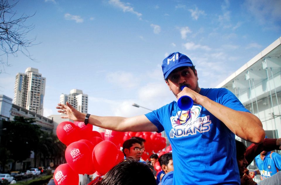 A Mumbai Indians' fan blows a horn as he arrives to watch the Indian Premier League (IPL) cricket match between the Mumbai Indians' and Deccan Chargers at a stadium in Mumbai May 14, 2011. REUTERS/Stringer/File Photo