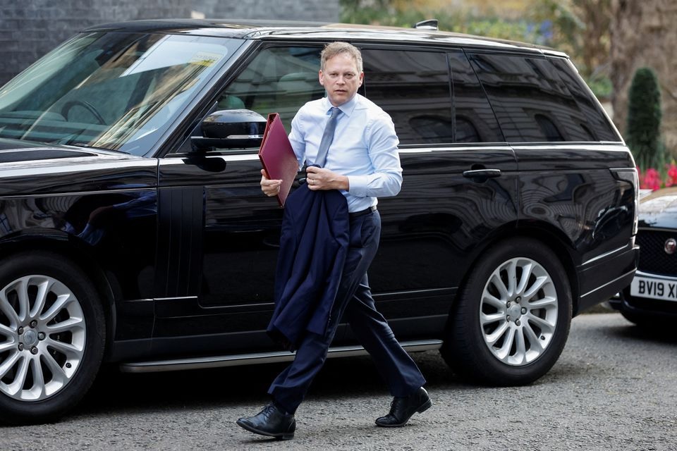 British Transport Secretary Grant Shapps walks outside Downing Street, in London, Britain, March 23, 2022. REUTERS/Peter Cziborra

