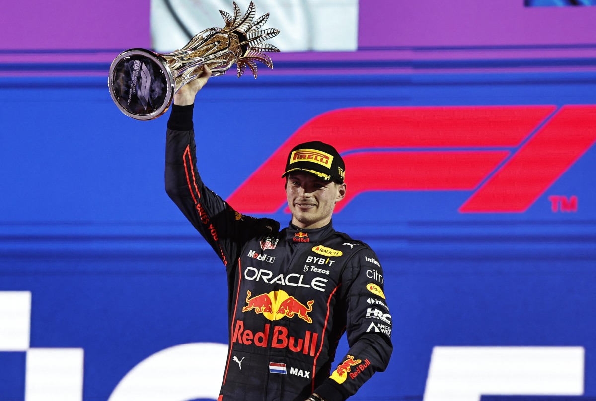 Red Bull's Max Verstappen celebrates on the podium with the trophy after winning the race REUTERS/Hamad I Mohammed
