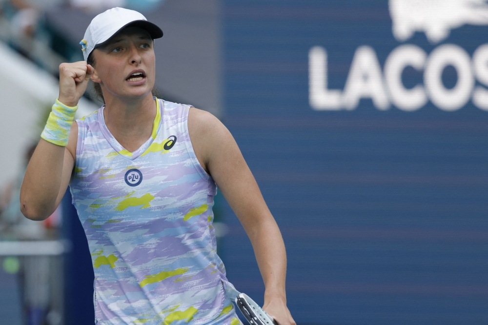 Iga Swiatek (POL) celebrates after match point against Cori Gauff (USA)(not pictured) in a fourth round women's singles match in the Miami Open at Hard Rock Stadium. Mandatory Credit: Geoff Burke-USA TODAY Sports
 