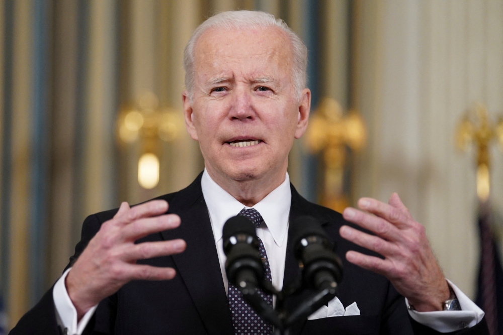 U.S. President Joe Biden responds to a question about Ukraine during an event to announce his budget proposal for fiscal year 2023, in the State Dining Room at the White House in Washington, U.S., March 28, 2022. REUTERS/Kevin Lamarque