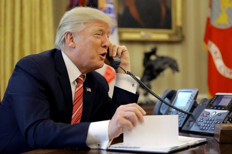 FILE PHOTO: U.S. President Donald Trump during a phone call from inside the Oval Office of the White House in Washington, U.S., June 27, 2017. REUTERS/Carlos Barria

