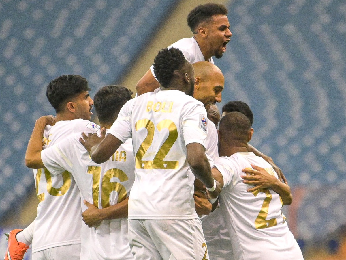 Al Rayyan players celebrate with Yohan Boli after the Ivorian scored his second goal, yesterday.
