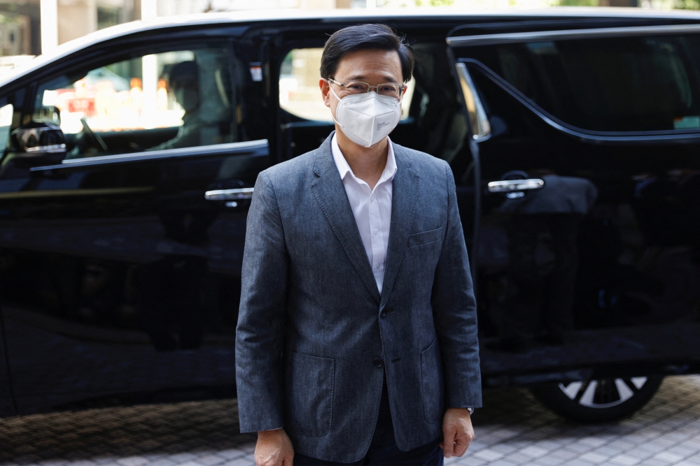 Former Hong Kong Chief Secretary for Administration John Lee, arrives at his office after Central People's Government approves his resignation, in Hong Kong, China, April 8, 2022. Reuters/Tyrone Siu