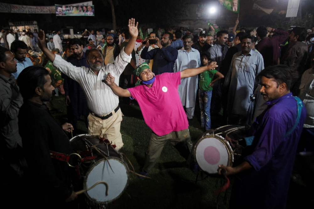 Supporters of the Pakistan Muslim League-Nawaz (PML-N) celebrate after Shehbaz Sharif was sworn in as the country's prime minister, in Lahore, Pakistan April 11, 2022. REUTERS/Mohsin Raza