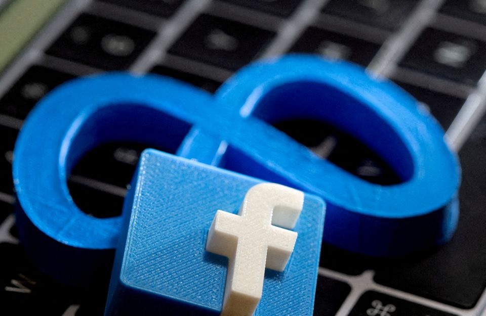 3D-printed images of the logos of Facebook and parent company Meta Platforms are seen on a laptop keyboard in this illustration taken on November 2, 2021. REUTERS/Dado Ruvic

