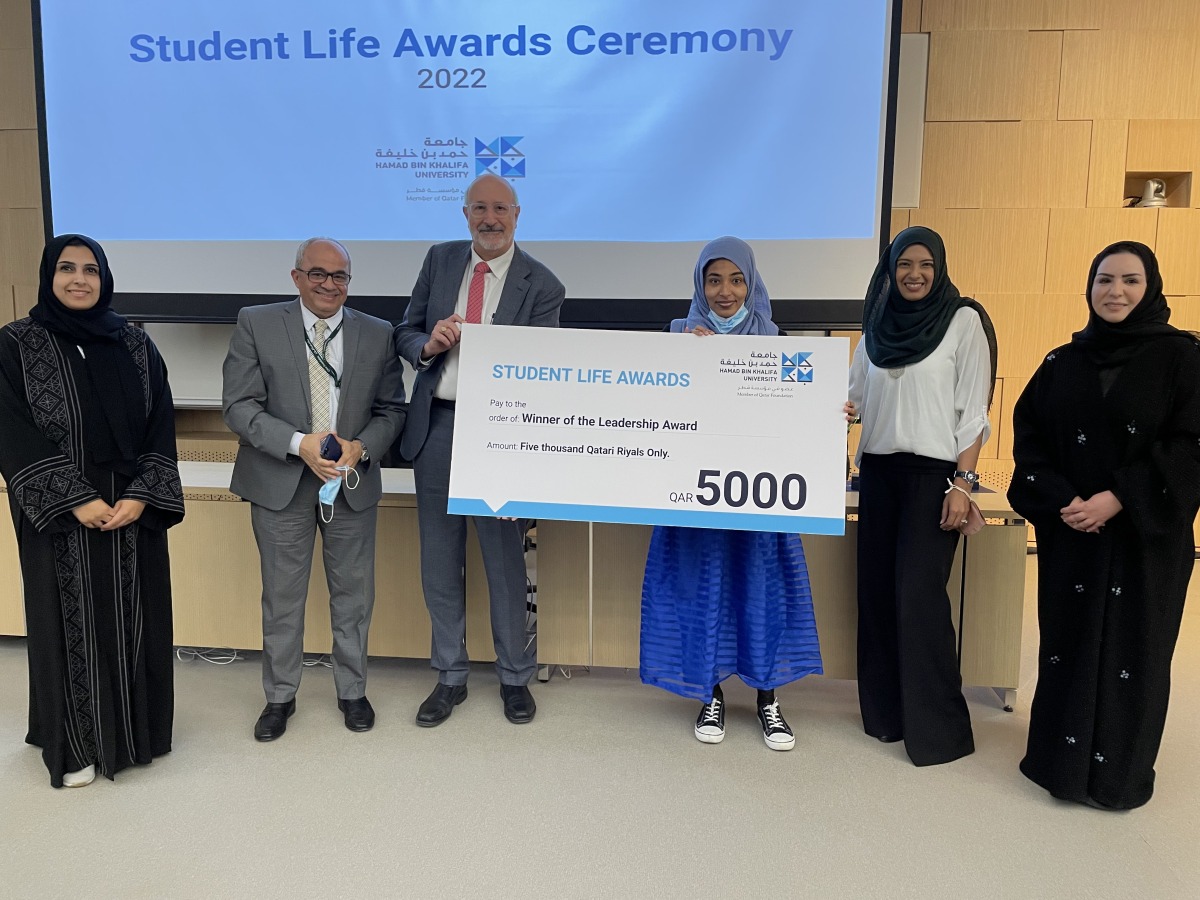 A student receives her award.