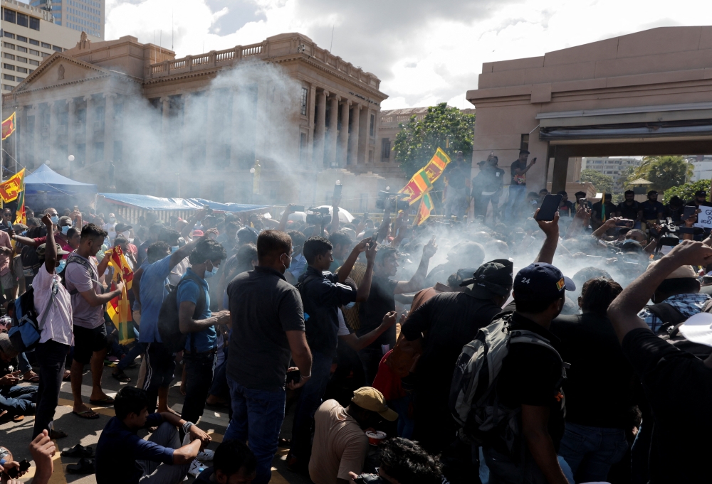 Demonstrators take part in a ritual of boiling milk to mark the Shinala and Tamil new year during their protest against Sri Lankan President Gotabaya Rajapaksa in front of the Presidential secretariat, amid the country's economic crisis in Colombo, Sri Lanka April 14, 2022. REUTERS/Dinuka Liyanawatte
