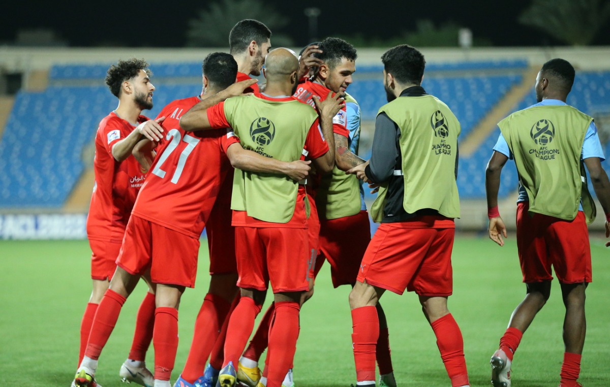 Al Duhail players celebrate their win over Pakhtakor.